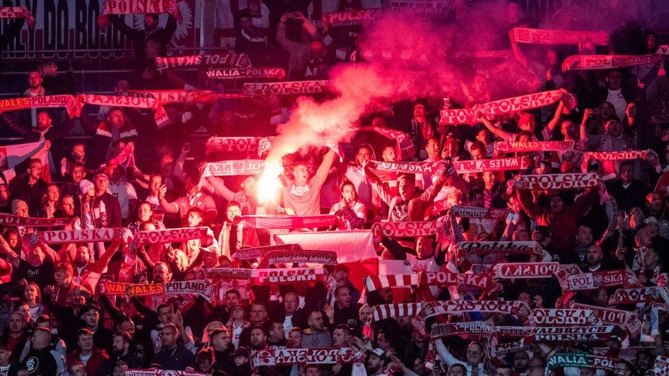 Flares among Poland fans at the Cardiff City Stadium