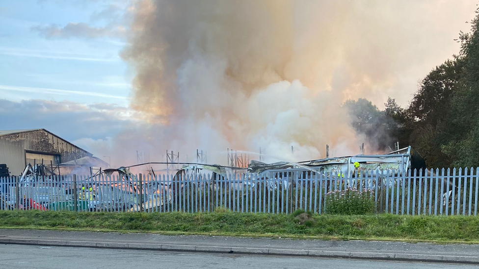 The factory ablaze and destroyed