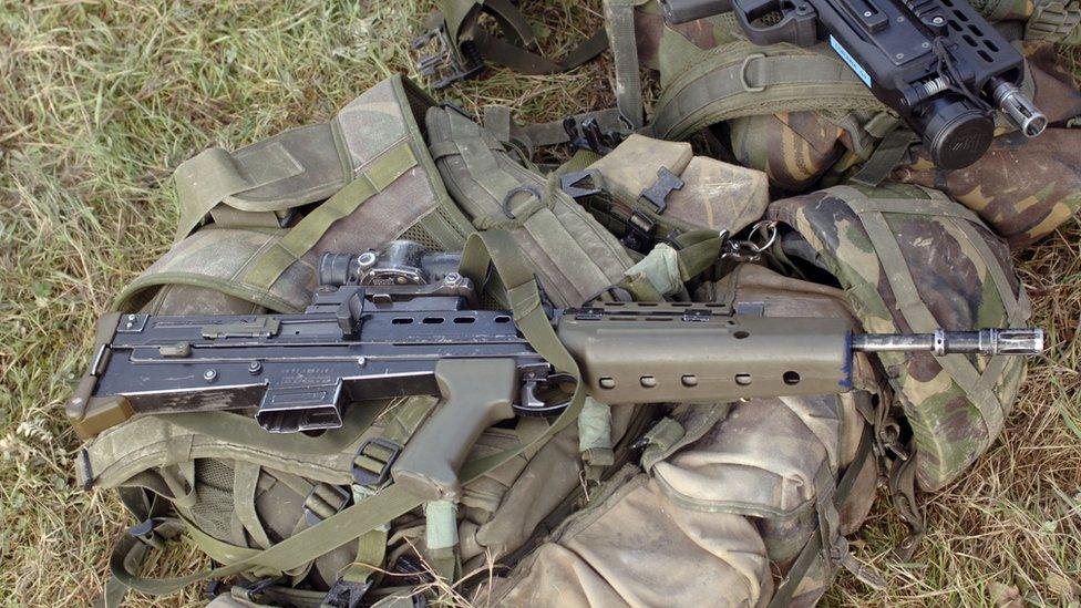 An SA80 assault rifle on top of Army gear