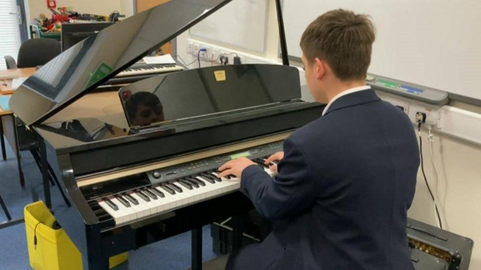 Student playing the piano