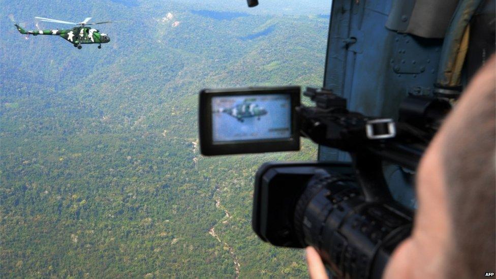 Army helicopters fly over the Vraem area