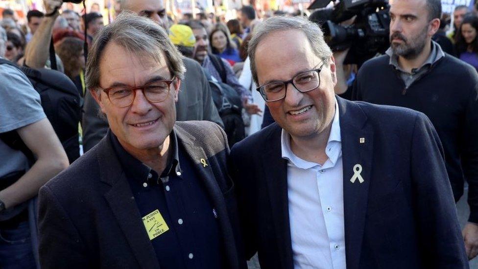 Catalonia's regional government president Quim Torra (right) and his predecessor Artur Mas (left) were at the rally