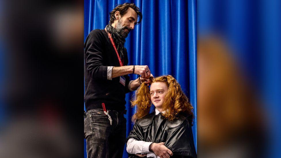 Jamie having his hair cut