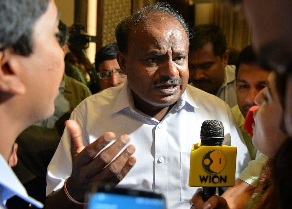 HD Kumaraswamy (C) speaks at a party meeting in Bangalore on 16 May 2018.