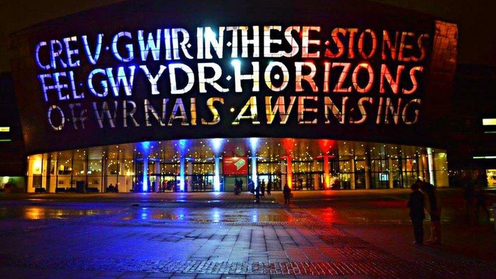 The Wales Millennium Centre in Cardiff illuminated in blue, white and red