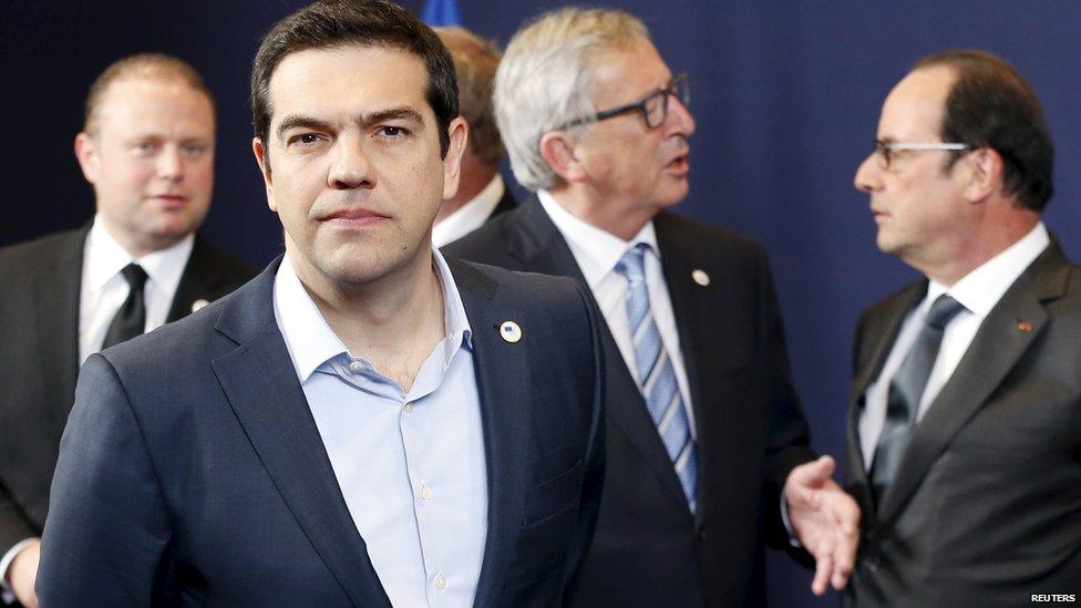 Greece's Prime Minister Alexis Tsipras leaves a family photo next to (back L-R) Malta's Prime Minister Joseph Muscat, European Commission President Jean-Claude Juncker and France's President Francois Hollande