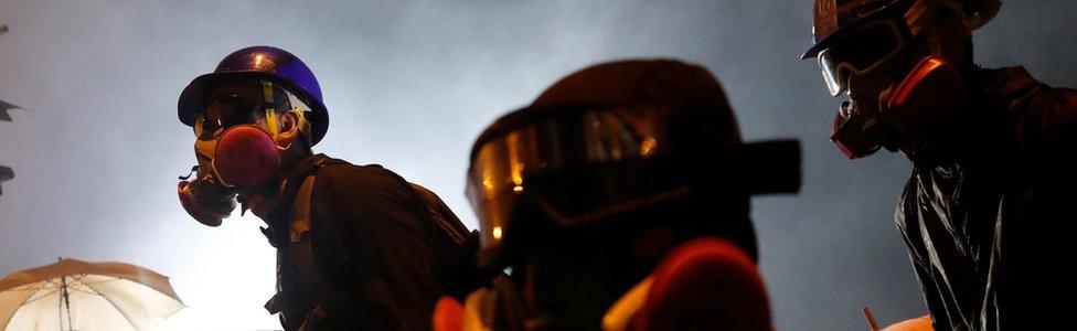 An anti-government protester holds a molotov cocktail during clashes with police outside Hong Kong Polytechnic University (PolyU) in Hong Kong, China, November 17, 2019.