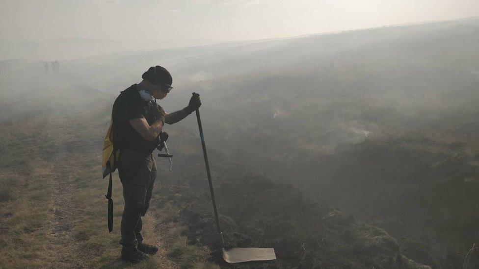 Volunteer fighting fire at Denshaw