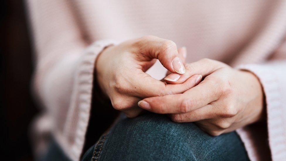 Anxious woman's hands