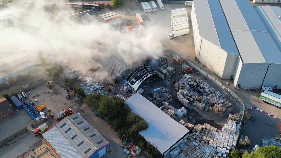 Smoke coming from a fire at a recycling factory in Corby