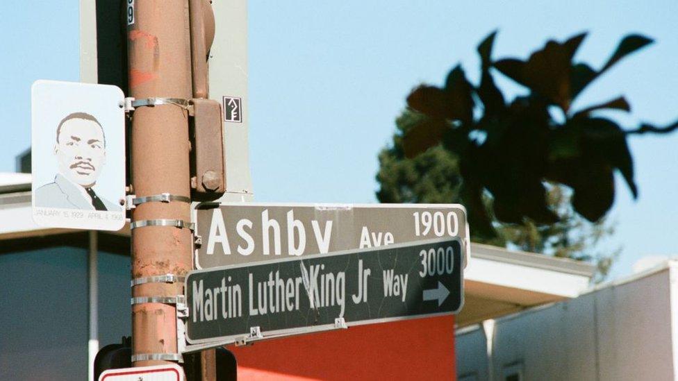 Close-up of sign at the intersection of Martin Luther King Jr Way in Berkeley, California