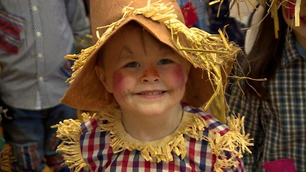 Child dressed as a scarecrow