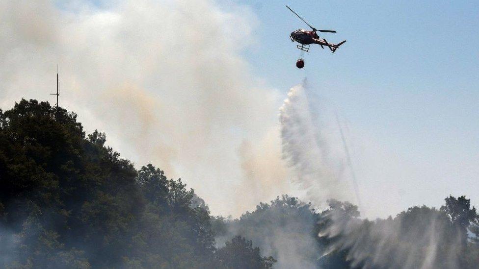 Helicopter fighting fire