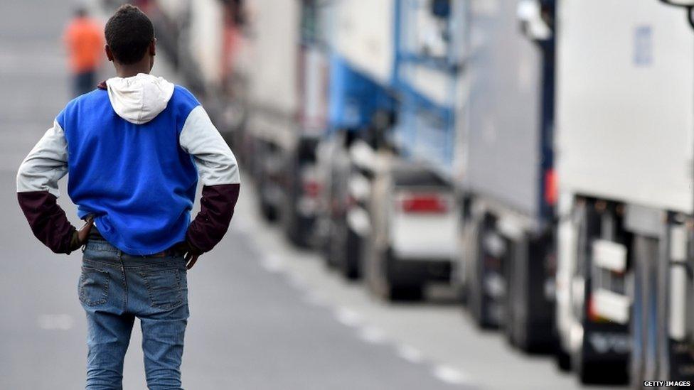 Migrant beside the road in Calais