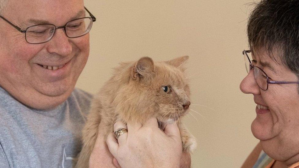 Keith, 53, and Su Bigland with his late mother"s beloved pet cat, Biscuit, known as Bikkit