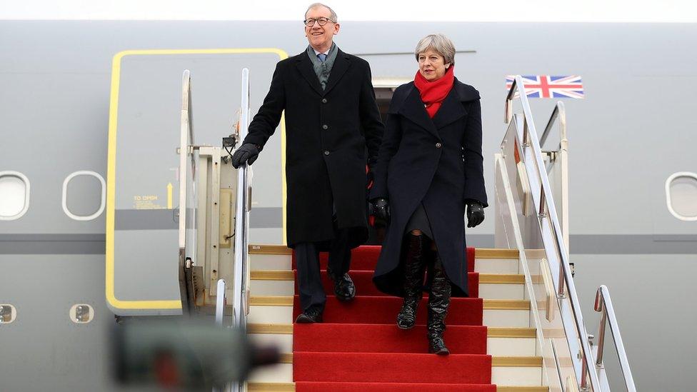 Theresa May and husband Philip arrive at Wuhan airport on 31 January 2018