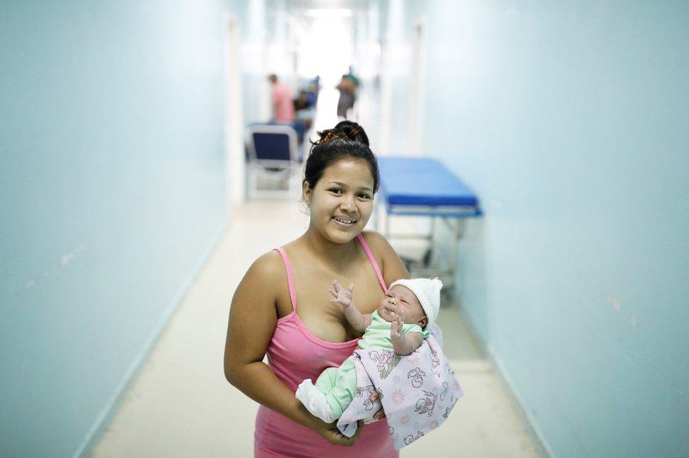 Lismaris, 21, a Venezuelan from Monagas state, holds her three-day-old baby Cecilia at a maternity hospital in Boa Vista, Roraima state, Brazil, 21 August 2018