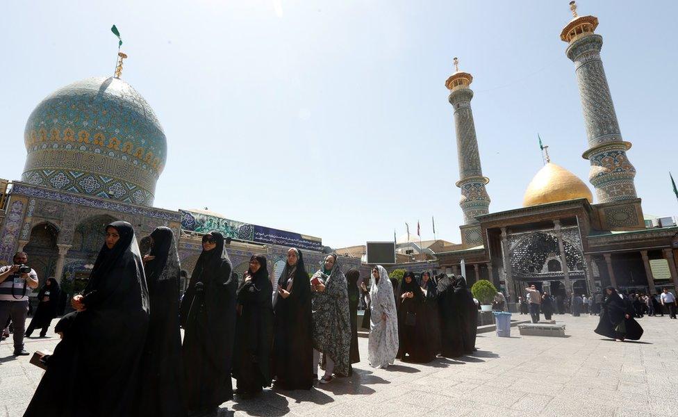 Veiled Iranian women waits in a line to cast their ballots in the Iranian presidential elections at a polling station set up at the Abdol Azim shrine in the city of Shahre-Ray, south of the capital of Tehran, Iran, 19 May 2017