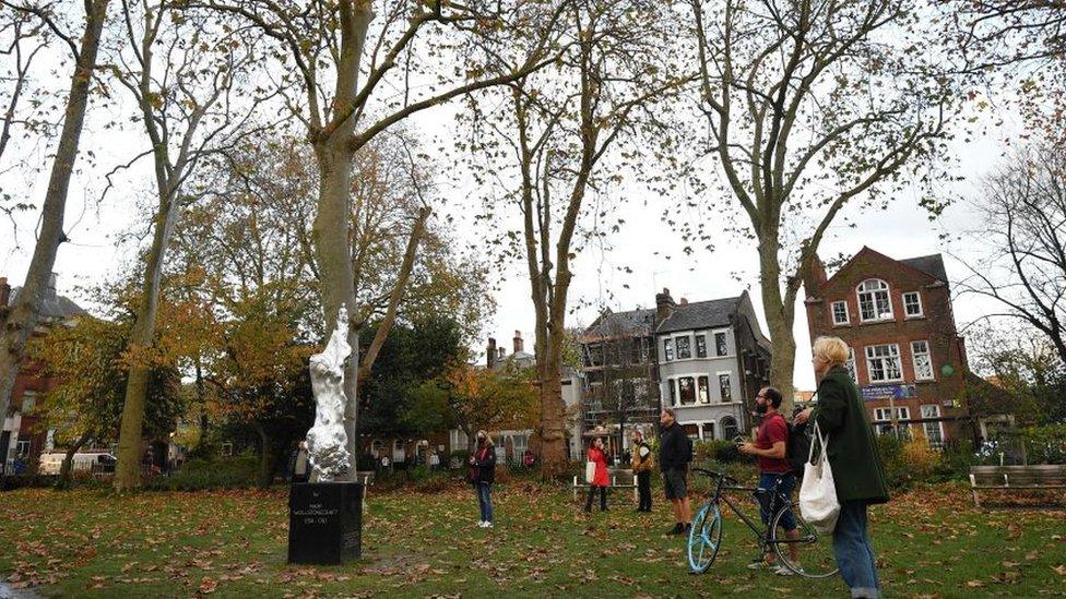 People taking photos of the Mary Wollstonecraft statue