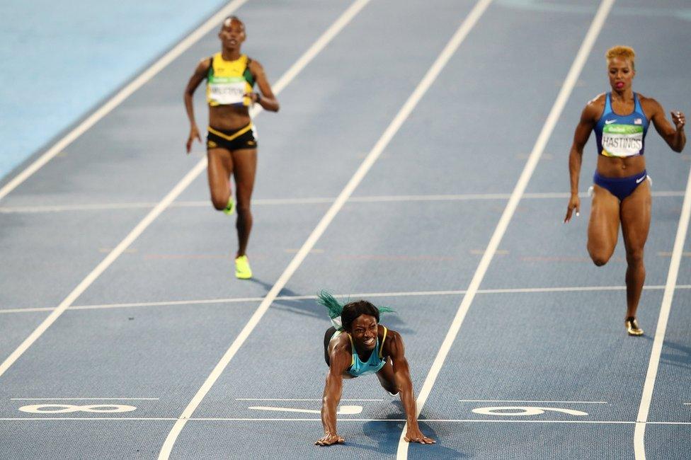 Shaunae Miller of the Bahamas dives over the finish line