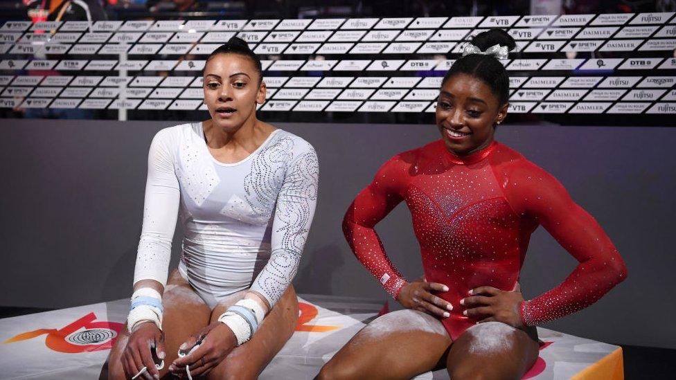 Becky Downie of Great Britain (left) and Simone Biles of United States (right) during the FIG Artistic Gymnastics World Championships in 2019