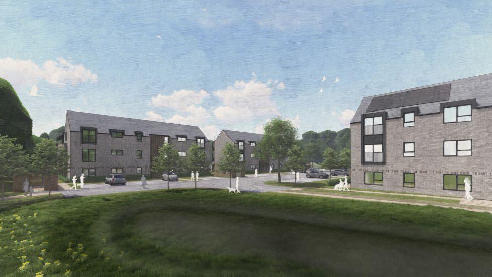 An artist impression shows three storey flats with a patch of green grass in the foreground and under a blue sky.