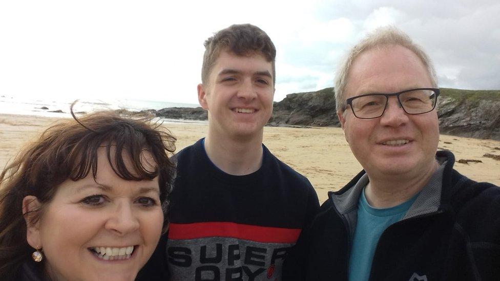 Robert Crowther with his family on the beach