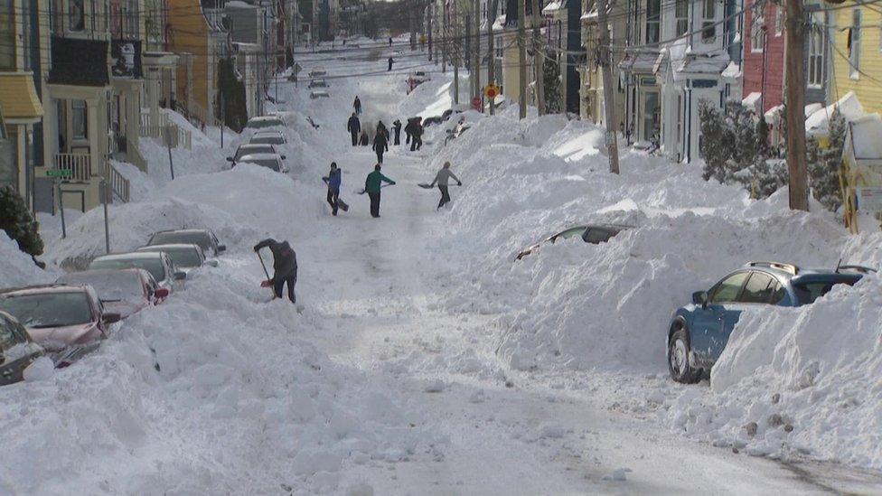 people-clearing-snow
