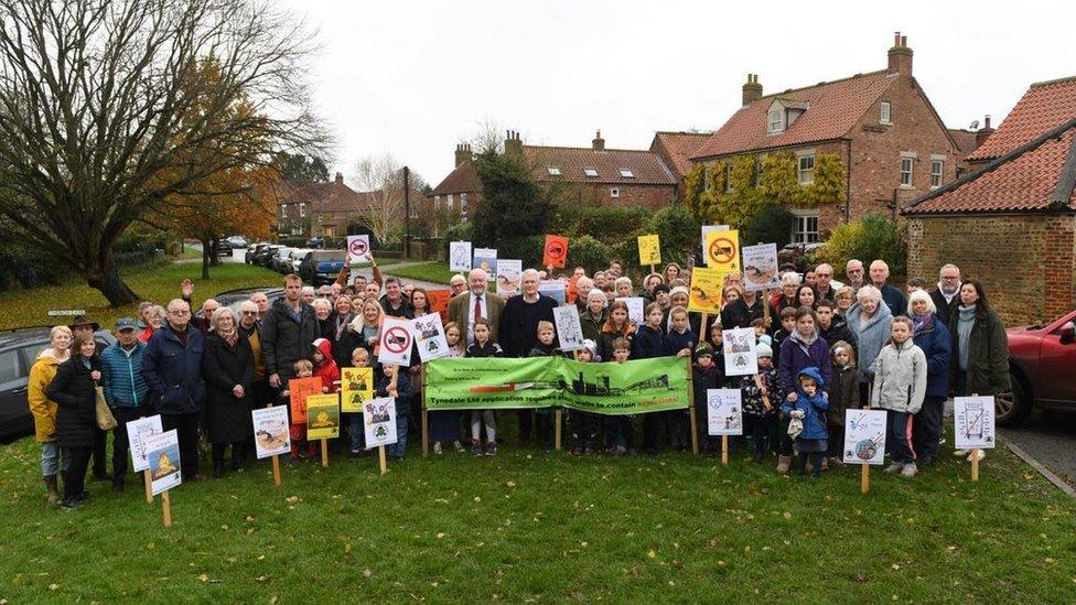 Campaigners in Marton holding posters