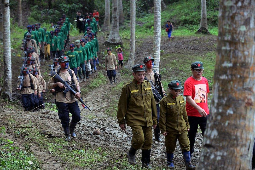 A picture made available on 29 December 2016 shows members of the NPA marching in a forest.