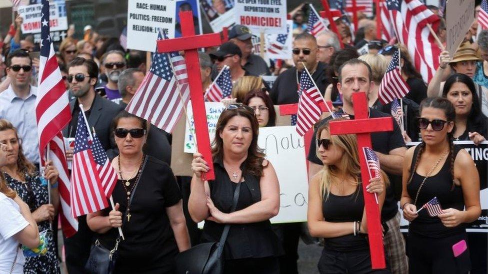 Protesters outside a federal court before a hearing to consider a class-action lawsuit filed on behalf of Iraqi nationals facing deportation.