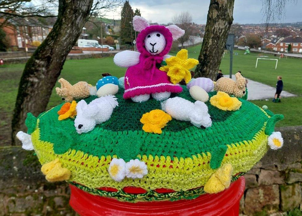 Knitted rabbits and eggs form part of the topper design