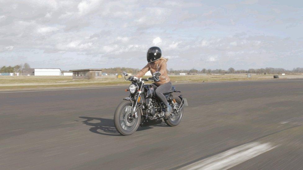 Karina Artun on a motorbike