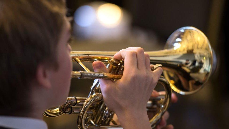 Boy playing cornet