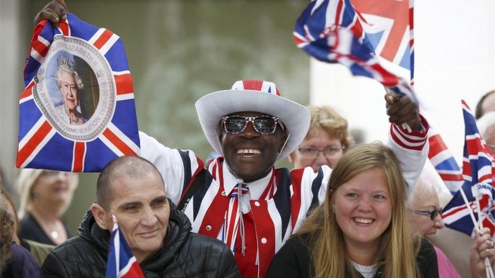 Well-wishers wait for the arrival of the Queen at a service of thanksgiving at St Paul's Cathedral in London.