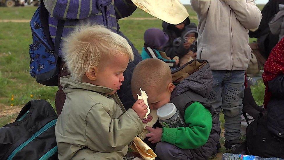 Children from Russia are photographed huddled together