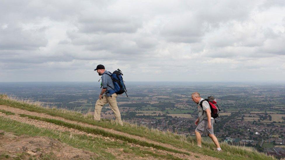 Hill walkers climb The Beacon, on 15th September 2018, in Malvern, Worcestershire