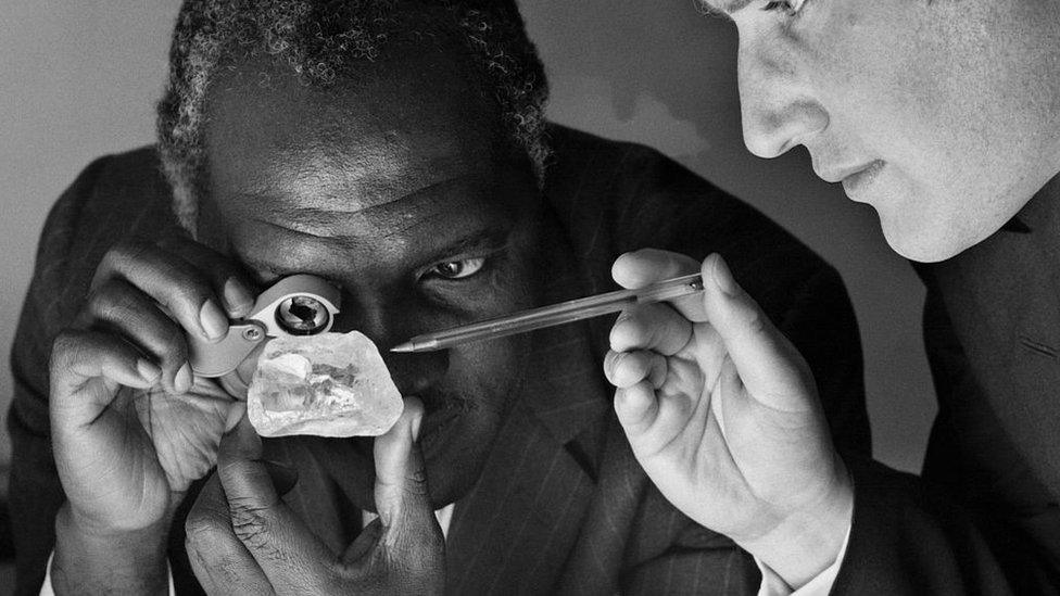 Davidson Nicol (L) High commissioner of London, and Anthony Oppenheimer (R) of the central selling organisation, studying the third largest diamond of the world