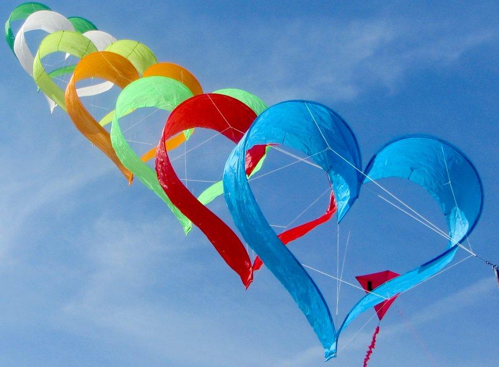 A row of heart shaped kites