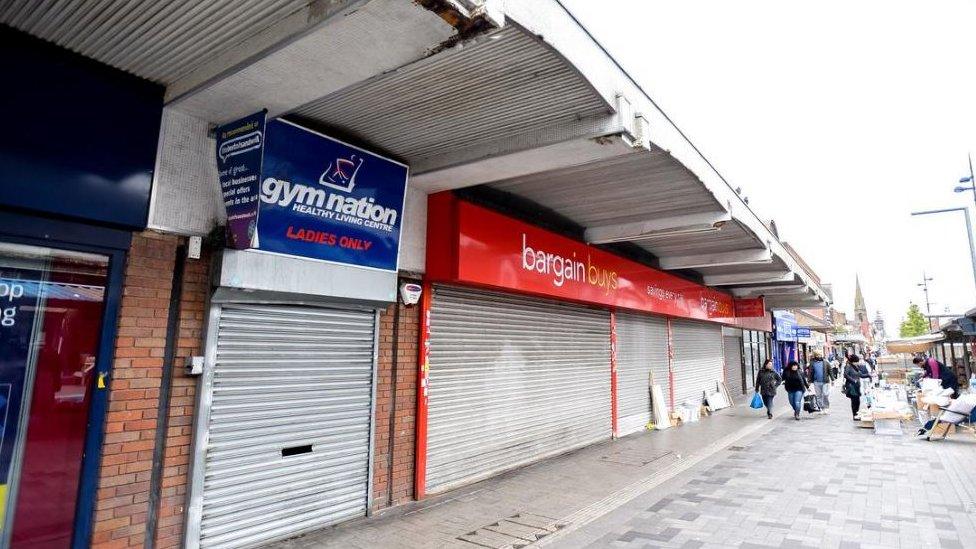 Shutters down on shop fronts