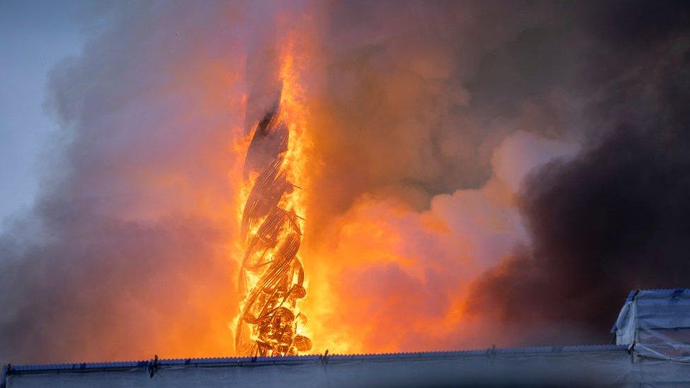 The tower of the historic Boersen stock exchange stands in flames as the building is on fire in central Copenhagen, Denmark on April 16, 2024