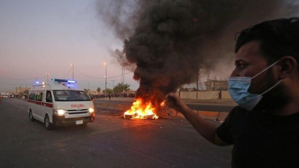 An ambulance arrives at the site of a demonstration in Baghdad's central Khellani Square on 4 October 2019