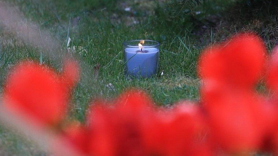 A lit candle marks one week since the death of PCSO Julia James, at her family home in Snowdown, near Aylesham