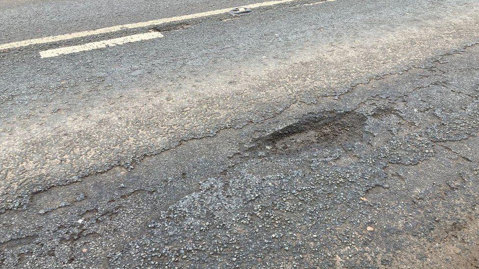 Pothole in road