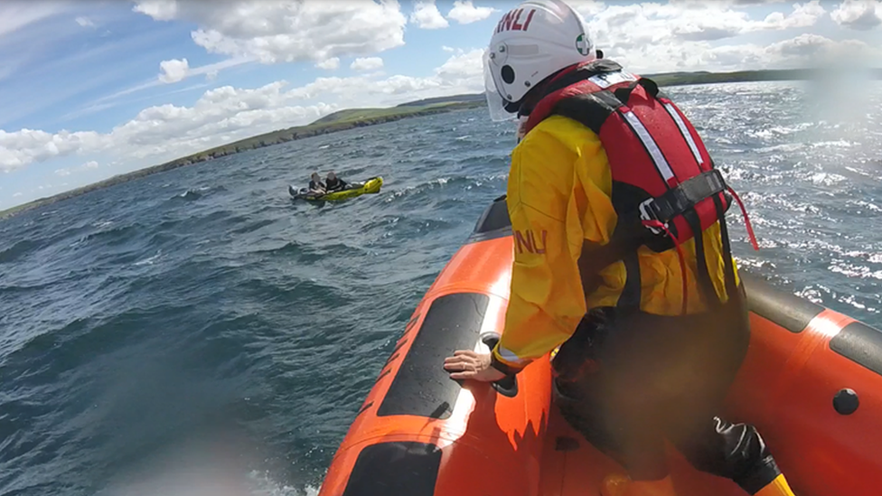 RNLI lifeboat going to kayakers