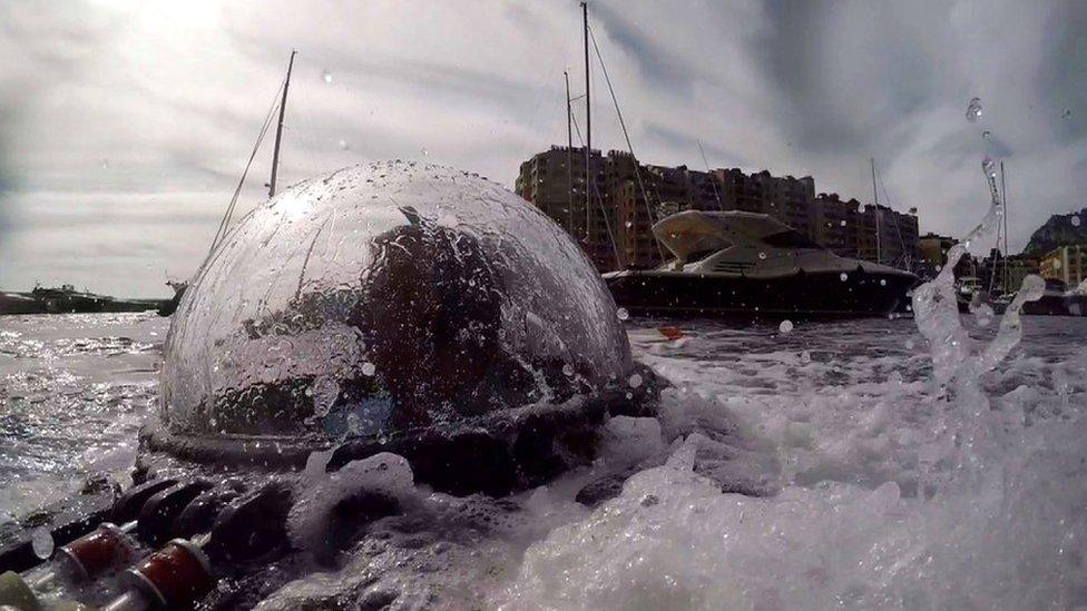 submarine emerging from the sea