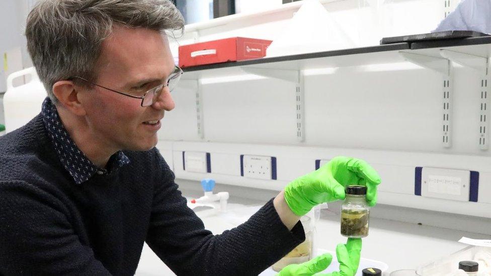 Jack Ashby holding a specimen jar