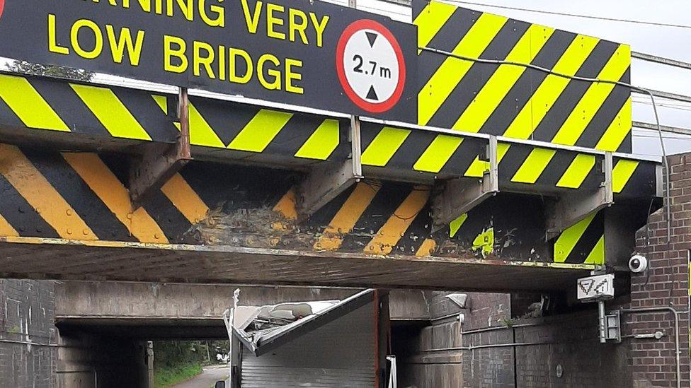 Van under bridge