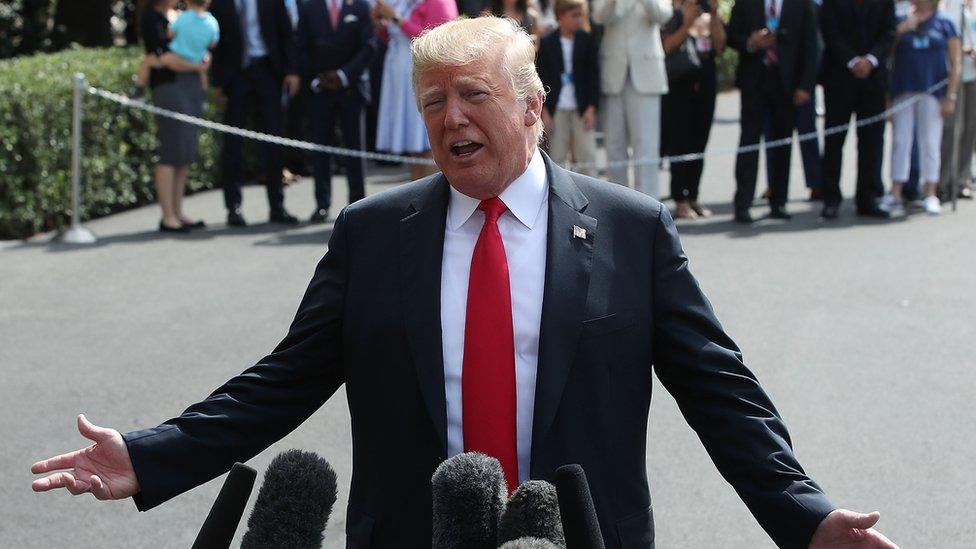 President Trump addressing reporters outside the White House