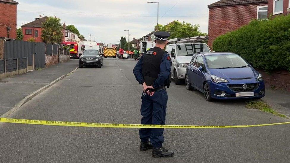 Police officer inside cordon in Reddish